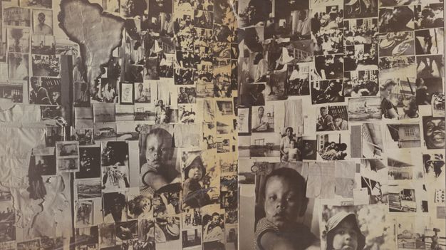 Collage of black and white photographs featuring diverse scenes and individuals, overlaid on a background map of South America. Prominent images include close-ups of children's faces, various people in different settings, architectural elements, and daily life activities, creating a complex tapestry of cultural and social elements. The artwork blends geographic and human elements to convey a narrative of identity and community.