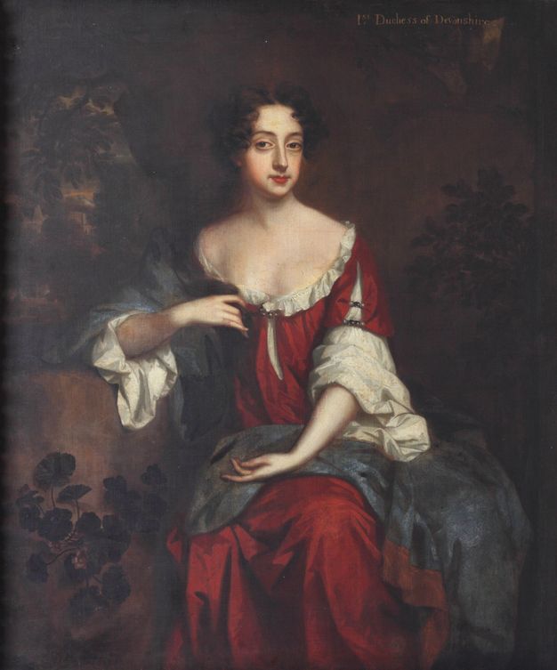 A portrait of a woman with pale skin and a boy with dark skin. They stand next to each other, with her right hand on his left shoulder, as he looks up at her. Both are richly dressed in flowing and abundant fabrics. The woman wears a jewelled hairpiece and the boy a drop earring.