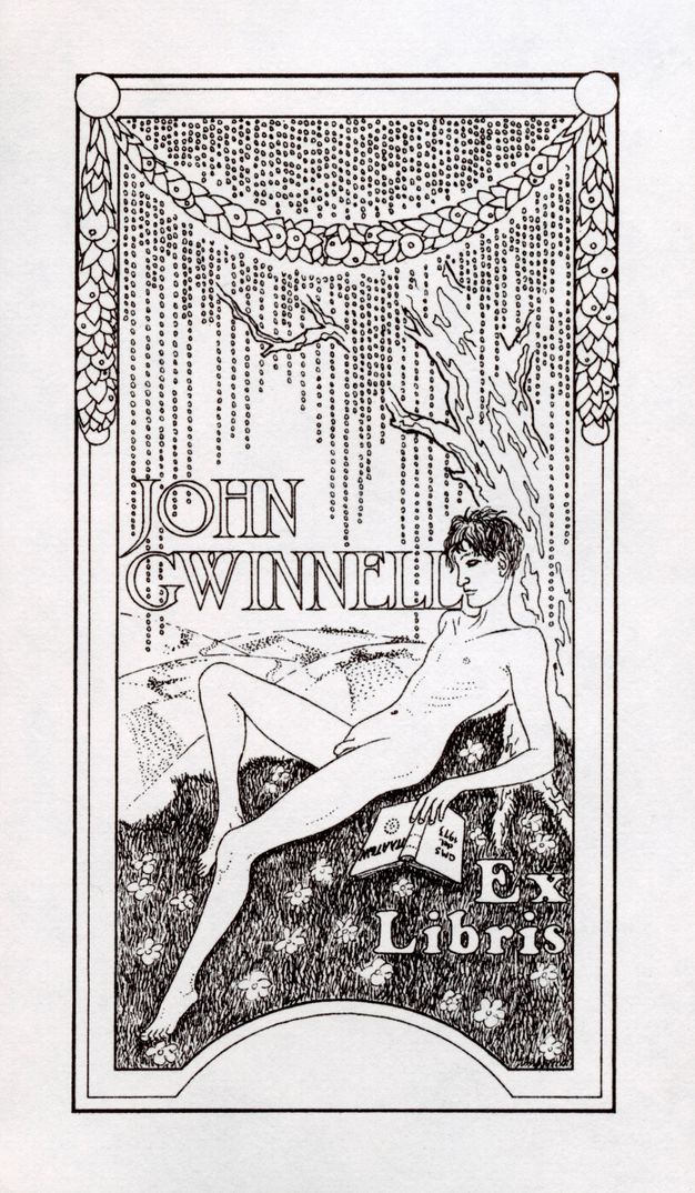 A pen and black ink design on white paper. Fine and detailed lines show a nude young man reclining under a tree in the countryside. He is surrounded by flowers in grass. An ornamental border above includes hanging garlands. Text in capital letters reads "John Gwinnell" in the middle of the composition and "Ex Libris" appears at the bottom right, alongside an open book in the man's hand.