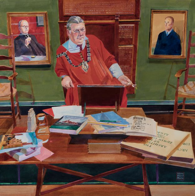 The image is a detailed painting featuring a central figure wearing a red robe and a ceremonial chain around the neck, standing at a desk. The desk is cluttered with various items including books, papers, and architectural plans. Prominently visible is a book titled "Dreamhouses." Behind the figure, there are two portrait paintings on the walls, and a board with engraved text. The setting appears to be an office or study, with two chairs positioned on either side of the desk, suggesting an environment