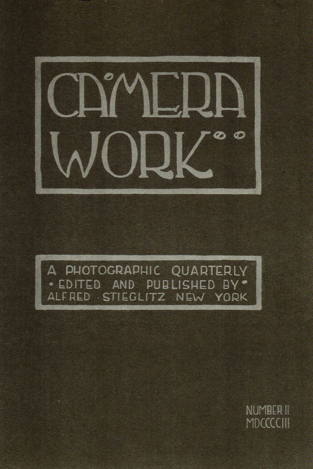 Cover image of "Camera Work," a photographic quarterly journal, edited and published by Alfred Stieglitz in New York. The cover features stylized typography in a rectangular frame with the title "Camera Work" prominently displayed. Below, it states, "A Photographic Quarterly Edited and Published by Alfred Stieglitz New York," with the issue number "II" and the year "MDCCCCIII" (1903) in the lower right corner, all set against a dark background.